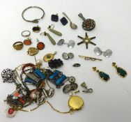 An assortment of costume jewellery including 9ct lockets, fobs, brooches, bracelets and various