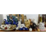 A large collection of ornamental animals including Beswick seated cats, Crown Devon dog group, a