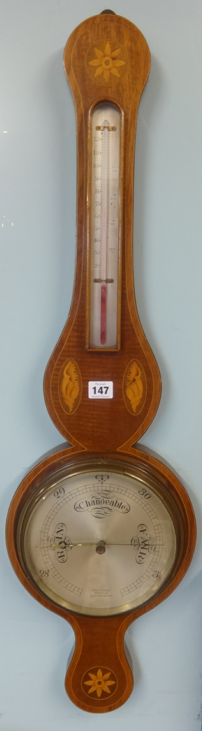 A Benn Franks reproduction banjo wall barometer of Georgian design with inlaid mahogany case.