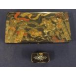 A Chinese papier mache decorated small box the lid decroated in gilt work with a scene of warriors