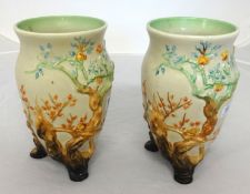 Clarice Cliff, a pair of vases with embossed Indian tree decoration, height 20cm.