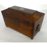 A 19th Century mahogany tea caddy, of sarcophagus shape, fitted with two tea boxes and a mixing