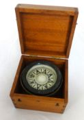 A marine compass in later mahogany box.