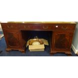 A reproduction mahogany pedestal partners desk approx, 152cm x 90cm x 77cm.