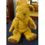 An English teddy bear circa 1930/40, with amber glass eyes.