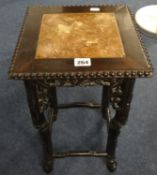 A small marble top table of Chinese design in hardwood, height 46cm, width 28cm.