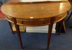 Oliver Morel, Cotswold School, a demi lune mahogany hall table with chequer inlay and fitted with
