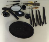 Ebony dressing table set and eleven assorted button hooks.