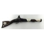 An early 19th Century Flintlock Blunderbuss, of short form and Eastern design, the barrel and