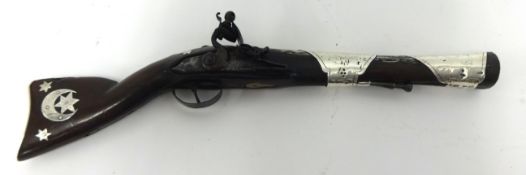 An early 19th Century Flintlock Blunderbuss, of short form and Eastern design, the barrel and
