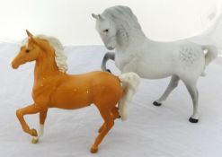 Two Beswick horses, a Palomino and a grey racehorse (2).