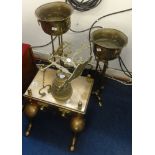 A 19th Century heavy brass footman, two brass adjustable jardineares and an ornate bell.