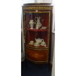 A reproduction French corner cabinet with single bow fronted glazed door, marquetry inlay and gilt