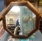 Oliver Morel, Cotswold School, an octangular wall mirror with chequer inlay and plaque verso 'OGM
