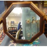 Oliver Morel, Cotswold School, an octangular wall mirror with chequer inlay and plaque verso 'OGM