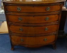 A old reproduction bow fronted mahogany chest fitted with four long drawers on bracket feet, the top