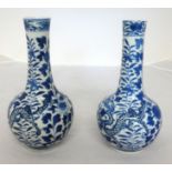 A pair of Chinese blue and white porcelain bottle vases decorated with dragons and flowers, each