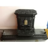 A French ornate iron wood burner stamped Godin and Laeken, Brevete, No.68, height 67cm, together