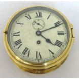 A brass cased ships clock with sub-second dial, 17cm diameter.