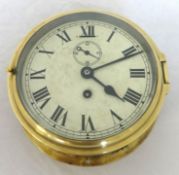 A brass cased ships clock with sub-second dial, 17cm diameter.