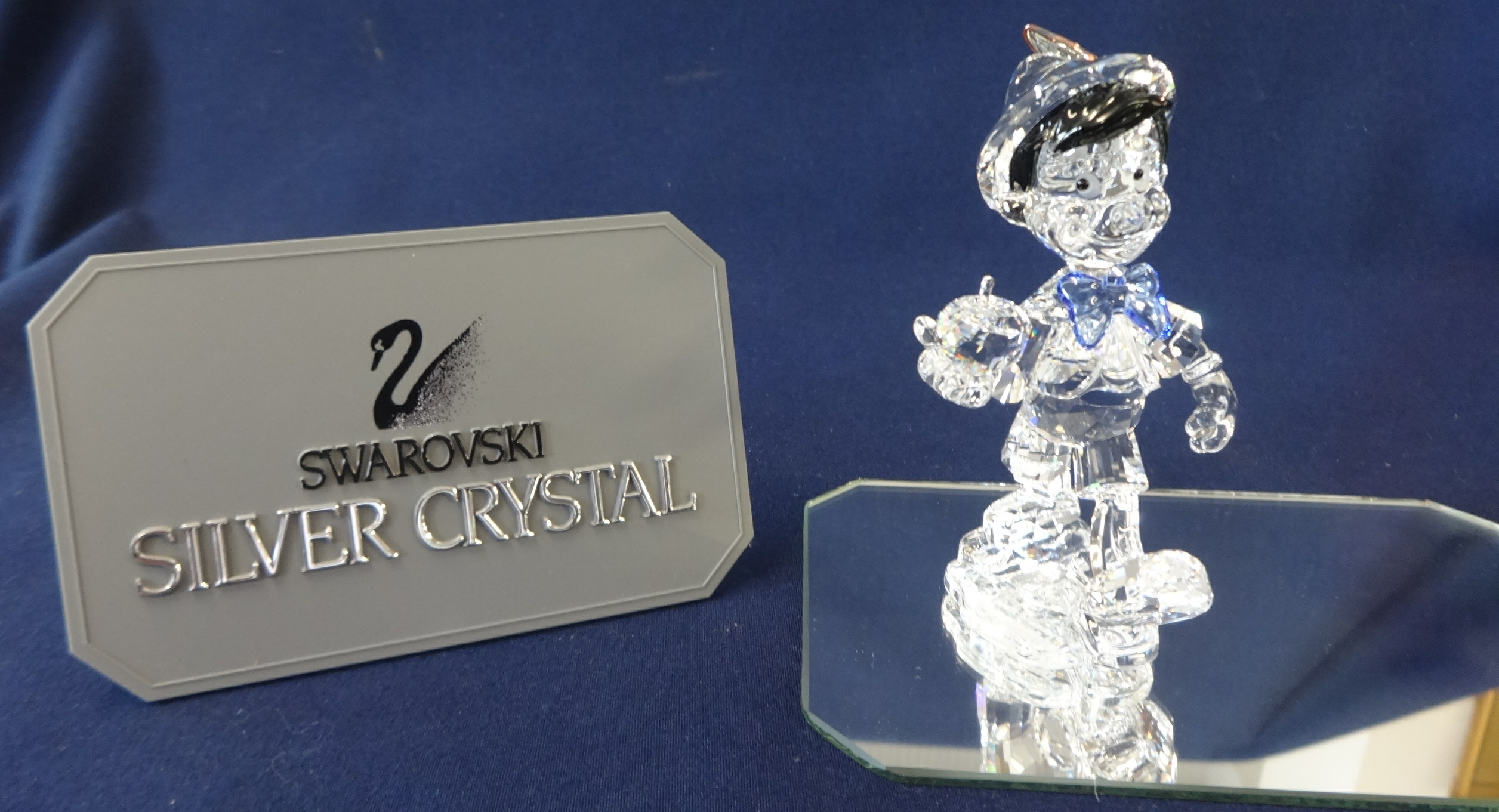 Swarovski Crystal Glass Disney 'Pinocchio' on glass stand, boxed as new