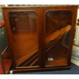 A Victorian mahogany two door glazed bookcase, width 124cm.