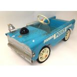 A 1960's Triang police department pedal car.