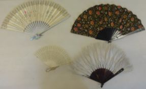 Collection of fans and combs including three ostrich feather fans.