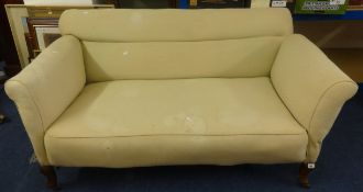 An Edwardian drop end settee (for re-upholstery).