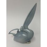 A modern pale blue vase in the shape of a Pelican, signed Arthur Thull, overall height 33cm.