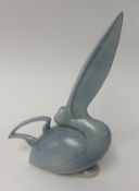 A modern pale blue vase in the shape of a Pelican, signed Arthur Thull, overall height 33cm.