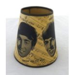 A Beatles lampshade .the black and white paper shade printed with facial portraits of the four