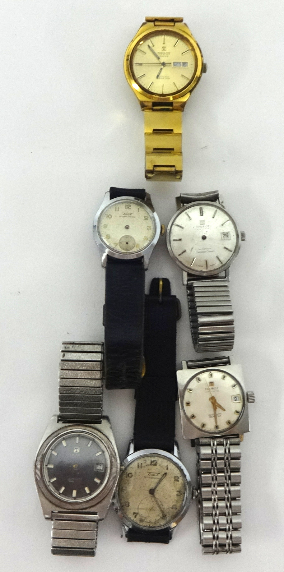 Six Tissot wristwatches.