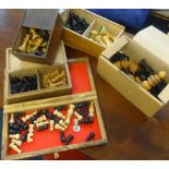 A collection of various wood chess sets, including Staunton and gaming board.