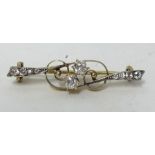 An antique diamond bar brooch set with an arrangement of ten old cut diamonds, length 38mm.