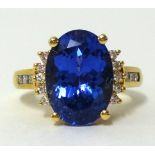 An 18ct large tanzanite and diamond set ring, finger size O.