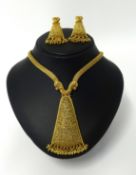 An impressive high carat yellow gold set of Indian Wedding jewellery, comprising necklace and