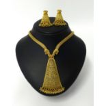 An impressive high carat yellow gold set of Indian Wedding jewellery, comprising necklace and