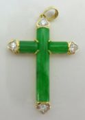 A modern jade and diamond cross set in 18ct yellow gold stamped .750, length 20mm, set with four