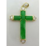 A modern jade and diamond cross set in 18ct yellow gold stamped .750, length 20mm, set with four