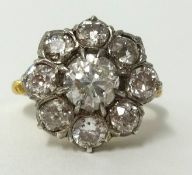 An 18ct diamond cluster ring, the centre stone, old European cut, approx 1.00 carat, with copy of