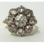 An 18ct diamond cluster ring, the centre stone, old European cut, approx 1.00 carat, with copy of