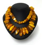 An amber necklace, approx 45cm long, various cuts, weight 150gms.