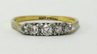 A 9ct five stone diamond set ring, finger size Q.