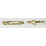 A 9ct gold bangle and another yellow metal bangle (not hallmarked), approx 23gms total weight (2).