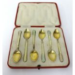Set of six silver gilt and enamel tea spoons, 'T&S', in original fitted case.