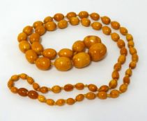 An amber necklace, approx 55cm long, largest bead approx 30mm x 25mm, weight 84.80gms.