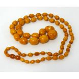 An amber necklace, approx 55cm long, largest bead approx 30mm x 25mm, weight 84.80gms.