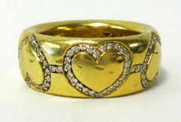 An 18ct yellow gold heavy band ring decorated with six diamond set hearts, approx 17.50gms, ring