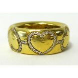 An 18ct yellow gold heavy band ring decorated with six diamond set hearts, approx 17.50gms, ring